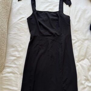 Elegant Black Sleeveless Dress with Tie Straps!